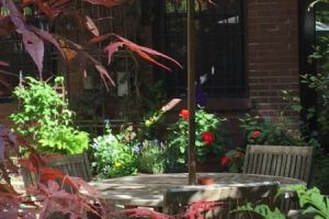 M325-9-Copley-Vacation-Rental-on-the-Park-Bedroom-Patio-in-spring-table