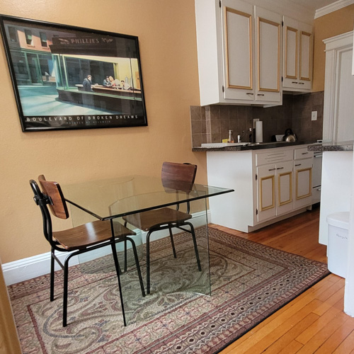 boston studio apartment table and kitchen